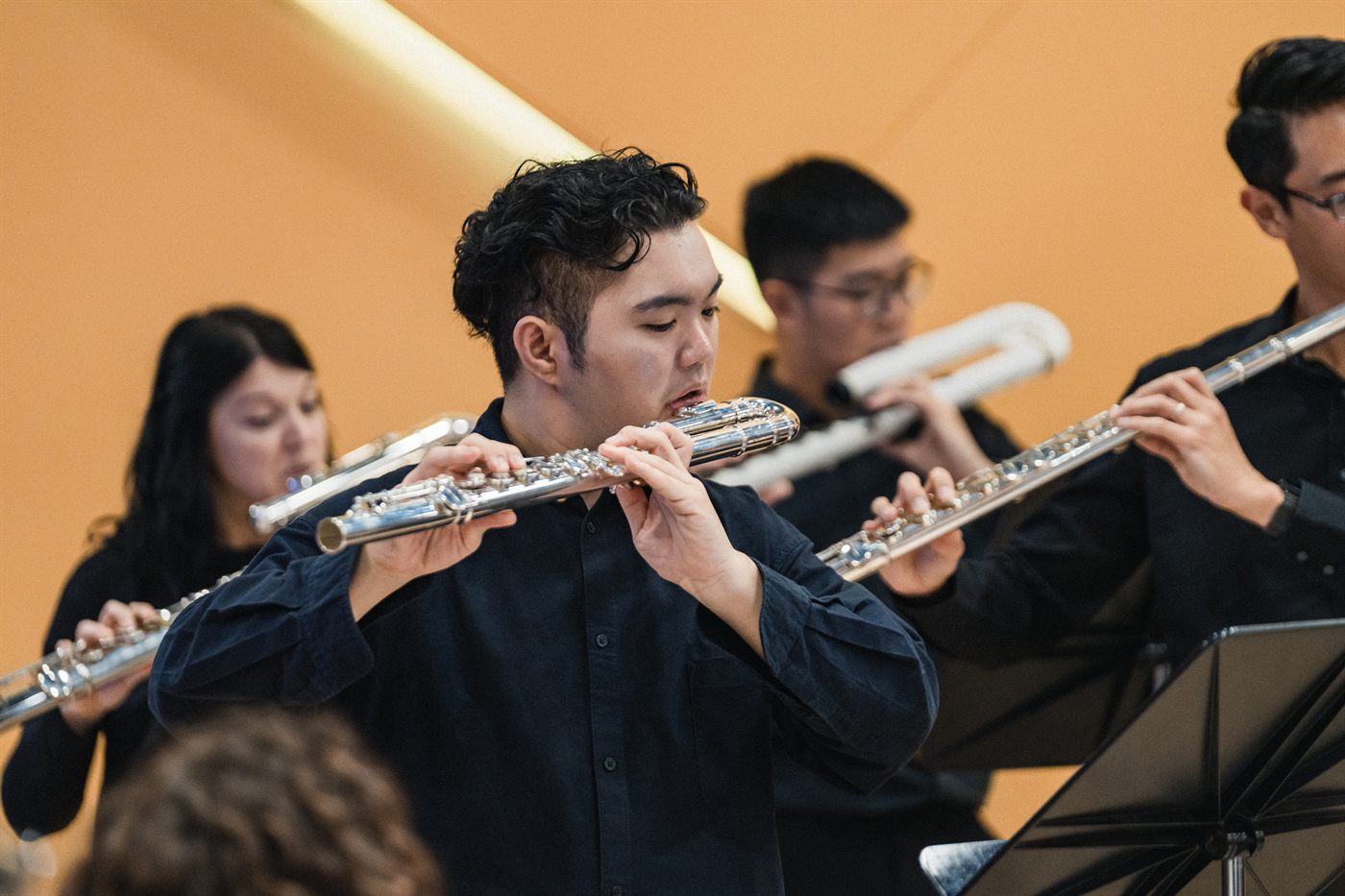 A King's Flute Choir musician playing the alto flute