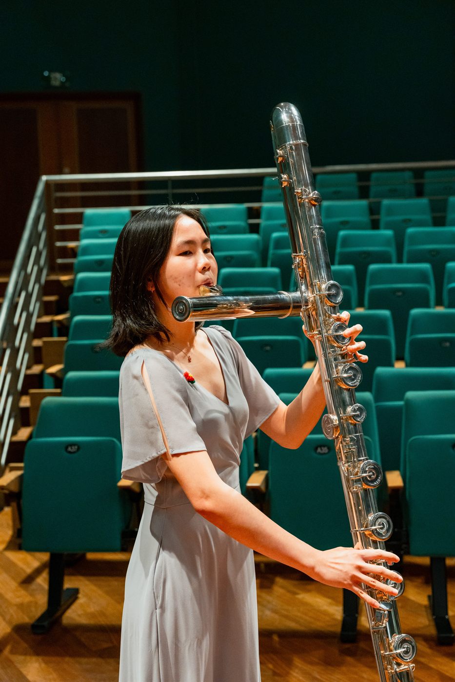 A King's Flute Choir musician playing the contrabass flute